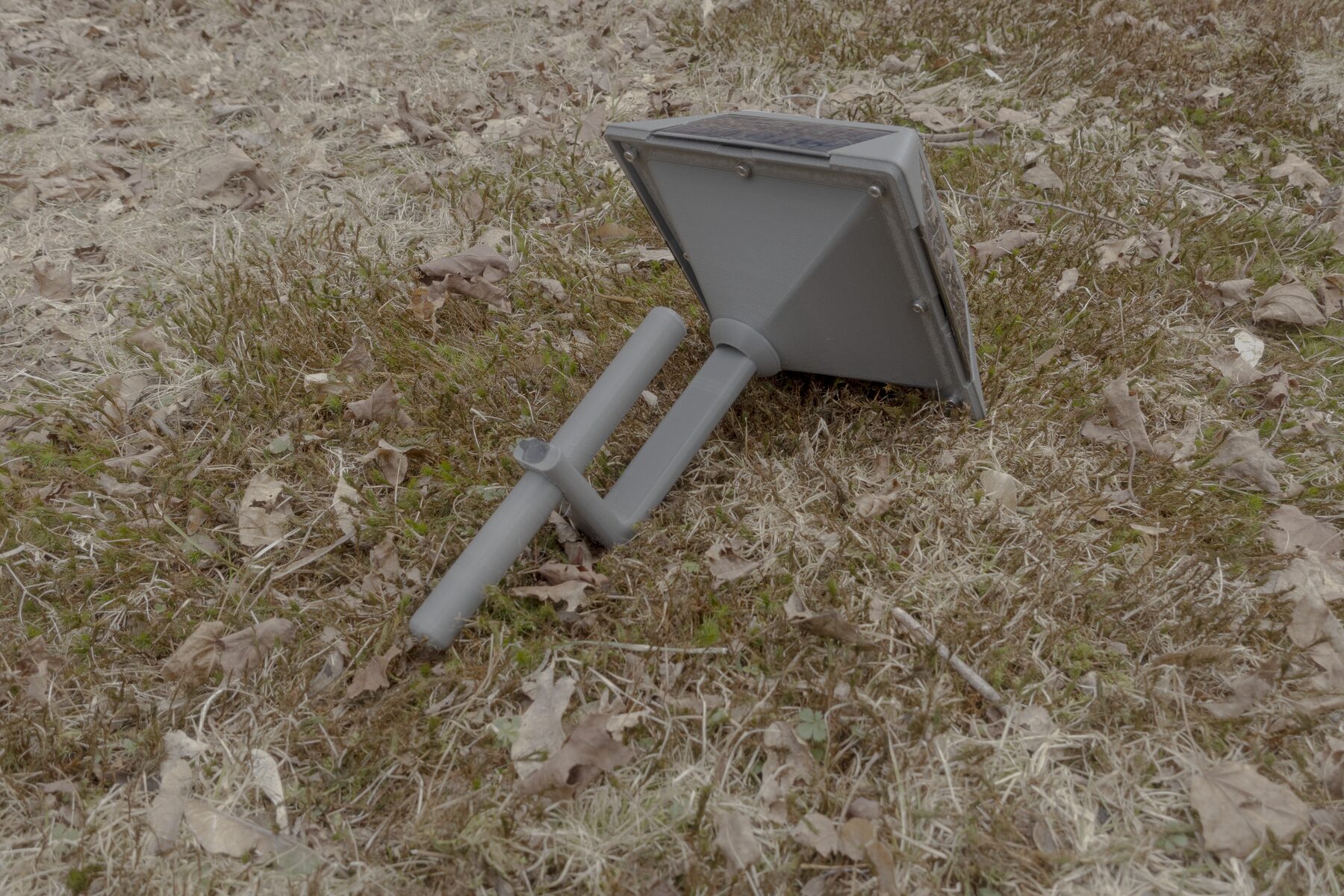 Rear underside view of the lantern node with tapered base and cylindrical stake mount.